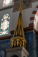 interior of historical Rustem Pasha Mosque at sunset. Ottoman architecture by Mimar Sinan shines amid peaceful rays, capturing a spiritual ambiance. Ramadan, islamic, muslim.