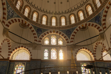 interior of historical Rustem Pasha Mosque at sunset. Ottoman architecture by Mimar Sinan shines amid peaceful rays, capturing a spiritual ambiance. Ramadan, islamic, muslim.