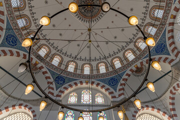 interior of historical Rustem Pasha Mosque at sunset. Ottoman architecture by Mimar Sinan shines amid peaceful rays, capturing a spiritual ambiance. Ramadan, islamic, muslim.