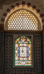 interior of historical Rustem Pasha Mosque at sunset. Ottoman architecture by Mimar Sinan shines amid peaceful rays, capturing a spiritual ambiance. Ramadan, islamic, muslim.