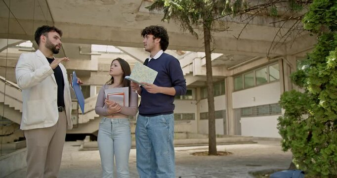 High school students consult with their professor after class, discussing a school science contest and preparing for tasks.