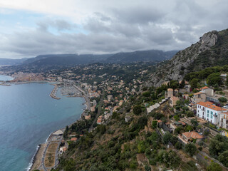 Fototapeta premium Colourful view on Italian Riviera and blue Mediterranean Sea from French-Italian border in Grimaldi village, Ventimiglia near San-Remo, travel destination, panoramic view