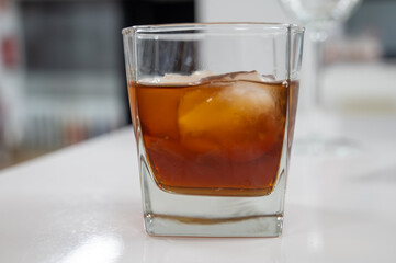 Tasting Sherry sweat cream wine on ice rocks, jerez fortified wine made from palomino white grape served in Jerez de la Frontera, Cadiz, Andalusia, Spain