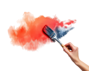 hand holding paintbrush applies gradient of red and orange paint on surface, creating vibrant and artistic effect