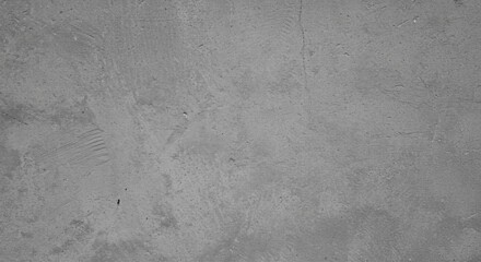 Fototapeta premium Concrete Texture: A detailed close-up shot revealing the raw, textured surface of a concrete wall. The image showcases the subtle variations in tone and the natural imperfections inherent in concrete.