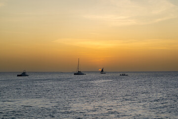 Boats and Sun Dipping Below the Horizon in Zanzibar