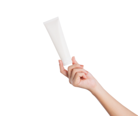 Female hand holding blank cosmetic bottle isolated on white background