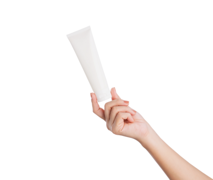 Female hand holding blank cosmetic bottle isolated on white background