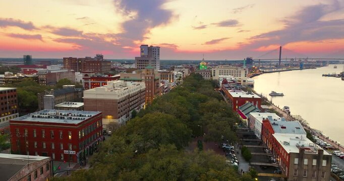 Panoramic cityscape with River Street old historical architecture in Savannah, Georgia. Southern American architecture in evening.