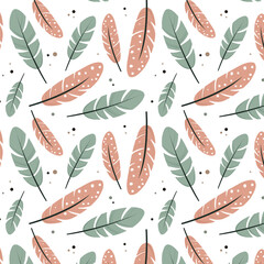 Seamless pattern of hand drawn feathers in soft pastel green and pink colors with polka dots and decorative elements. Ideal for textile design, wallpapers, wrapping paper, and stationery.