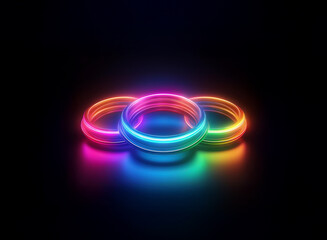 Three vibrant, neon rings intersect, casting colorful reflections on a dark, glossy surface.  The rings glow with an inner light, creating a visually striking image.