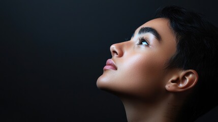 Fototapeta premium portrait with a side profile of a person gazing up, highlighting their features