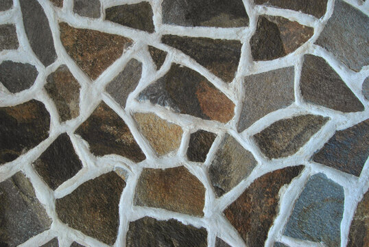 Natural rubble stone wall texture as background