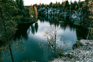 Landscape of blue deep lake light daytime, clouds sky, Ruskeala Karelia Russia