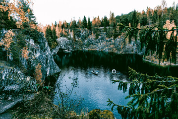 Landscape of blue deep lake light daytime, clouds sky, Ruskeala Karelia Russia
