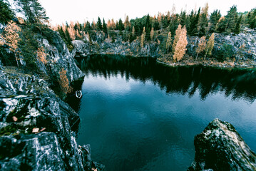 Landscape of blue deep lake light daytime, clouds sky, Ruskeala Karelia Russia