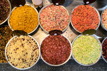 Colorful bins of specialty fruit tea blends in the Mahane Yehuda market in Jerusalem, Israel.