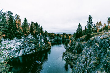 Landscape of blue deep lake light daytime, clouds sky, Ruskeala Karelia Russia