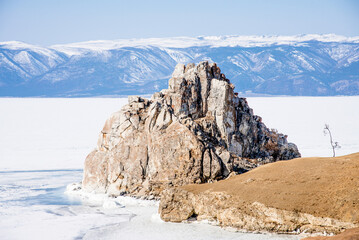 Landscape ice blue deep lake winter clouds Baikal Siberia Russia rock Shamanka