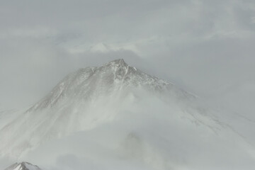 Fototapeta premium Aerial view of mountains and fog in Antarctica.