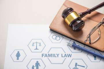 Judge gavel, pen, eyeglasses. Family Law concept