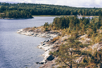 Landscape blue deep lake light sun, clouds sky mountains Ladoga skerries Karelia