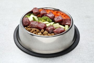 Dry pet food and natural products on light table, closeup
