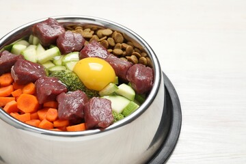 Dry pet food and natural products on white wooden table, closeup