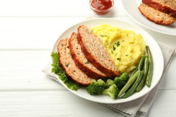 Delicious baked turkey meatloaf with mashed potato served on white wooden table, closeup. Space for text