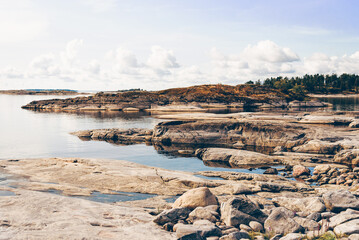 Landscape blue deep lake light sun, clouds sky mountains Ladoga skerries Karelia
