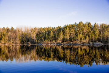 Landscape blue deep lake light sun, clouds sky mountains Ladoga skerries Karelia