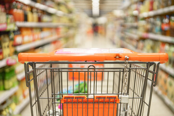 Empty grocery cart for groceries in supermarket for shopping.