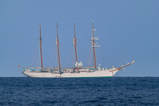 Tenerife, Spain; January 16 2025: Juan Sebasti&aacute;n de Elcano,  Spanish Navy steel hulled barquentine training ship, anchored off the coast of Tenerife, on the horizon