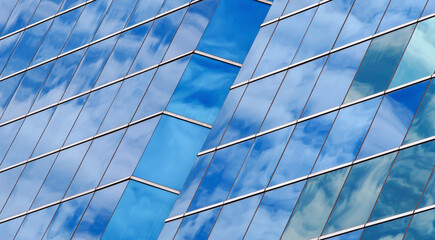 Dynamic Glass Reflections..A rhythmic play of sky reflections on a modern glass facade—perfect for architectural presentations or creative design concepts.