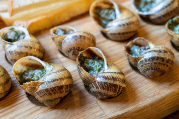 Delicious escargot dish with garlic butter sauce and fresh baguette