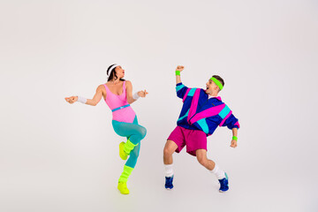 Surprised young businesswoman pointing with a shocked expression on a khaki background, wearing an elegant blouse.