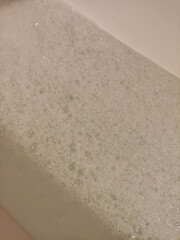 White foam creating a relaxing atmosphere in a bathtub, perfect for a valentine's day soak valentine's day spa copy space