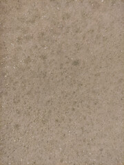 Small foam bubbles creating an interesting texture on a light brown surface, perfect for backgrounds and textures valentine's day spa copy space mobile wallpapper