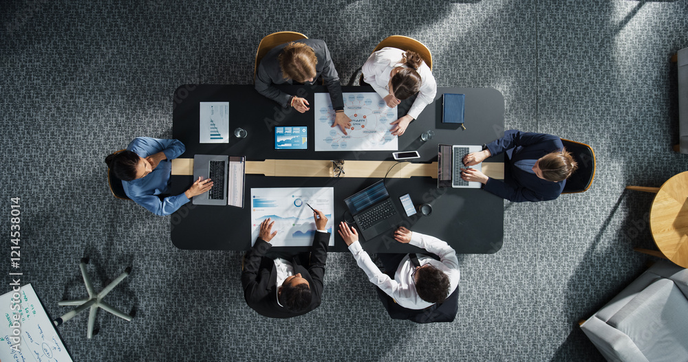 Aufkleber top down view: diverse professionals working on business statistics reports and digital plans in an 