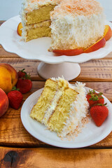 coconut peach layer cake with vanilla icing