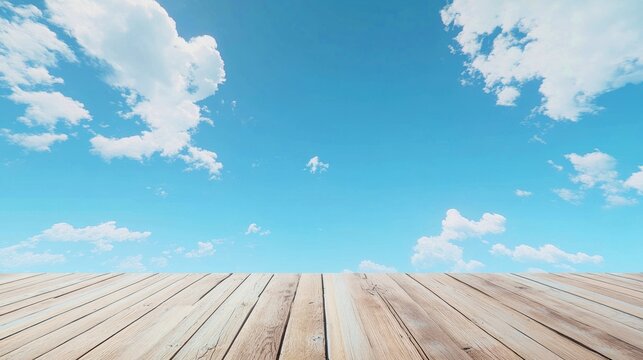 Wooden floor with blue sky and white clouds in the background, creating a natural and serene atmosphere. The vibrant blue sky and fluffy white clouds contrast with the wooden surface