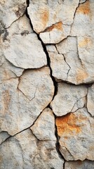 Obraz premium Textured stacked stone wall with natural earthy tones