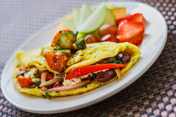 Greek omelette served with fresh fruit