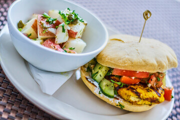 grilled chicken sandwich with sautéed vegetables