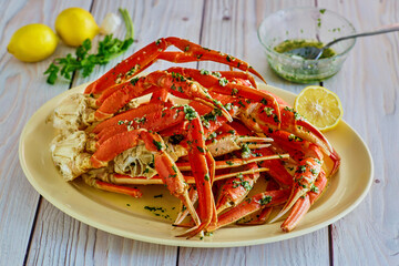 crab legs clusters smothered in garlic lemon butter © James