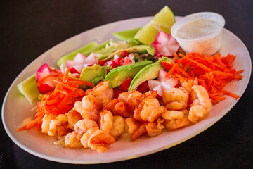 sauteed shrimp salad with avocado and tomato
