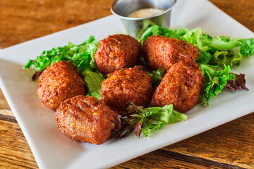 crispy fried seafood fritters with a tartar sauce