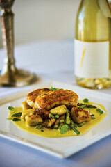 seared halibut with roasted vegetables and curry coconut sauce