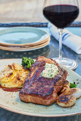 seared ribeye steak topped with an herb butter