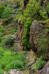Two trekkers on the Annapurna Circuit Trek. Travellers with Backpack hiking in the mountains. Mountaineering sport concept. Hiking trekking concept. Annapurna Conservation Area, Nepal.